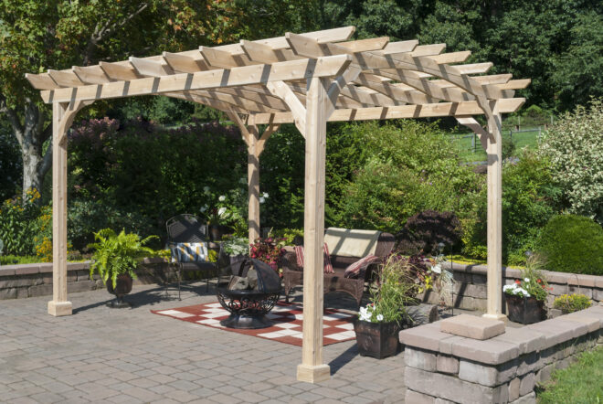 A wooden pergola shading a sitting area.